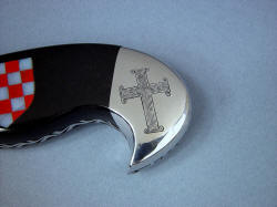 "Duhovni Ratnik" obverse side rear bolster engraving detail. Hand-engraving of 1000 year old cross design in stainless steel