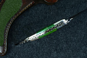 "Raptor" spine filework and thickness detail, noting complex filework and fullly tapered tang, with dovetailed fittings and gemstone scales "Raptor" spine filework and thickness detail, noting complex filework and fullly tapered tang, with dovetailed fittings and gemstone scales