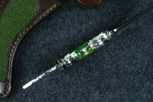 "Raptor" inside handle tang view, with deeply contoured finger grooves and bolsters, dovetailed fittings and gemstone handle scales, fully tapered tang "Raptor" inside handle tang view, with deeply contoured finger grooves and bolsters, dovetailed fittings and gemstone handle scales, fully tapered tang