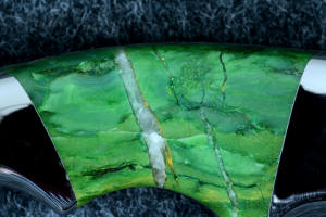 "Raptor" reverse side gemstone handle detail, 6X enlargement, showing quartz and other inclusions of budstone (Verdite) from South Africa "Raptor" reverse side gemstone handle detail, 6X enlargement, showing quartz and other inclusions of budstone (Verdite) from South Africa